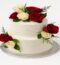 Two-tier white cake decorated with red and white roses, perfect for weddings and anniversaries