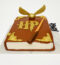 Harry Potter Theme Cake shaped like a magical spellbook with wand, golden snitch, and HP logo – perfect for wizard themed birthdays BakersStreet.in