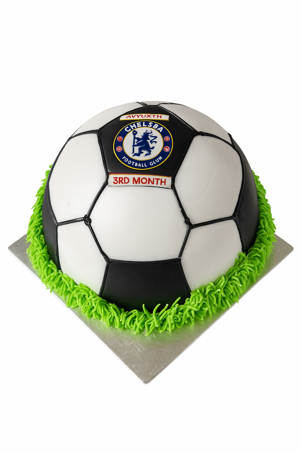 Football theme cake shaped like a soccer ball with green icing base