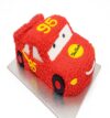Lightning McQueen Car Cake shaped kids birthday cake in red color freshly baked at BakersStreet Yelahanka with customizable flavors eggless and sugar free options